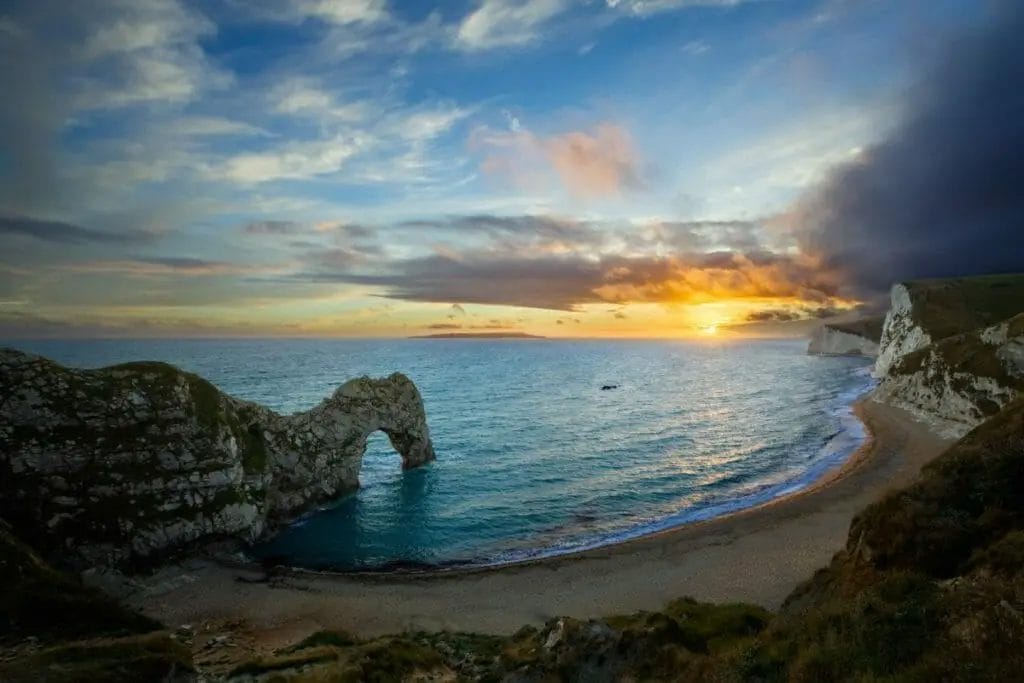 Famous Landmarks in the United Kingdom - Durdle Door, sunset, england, sky