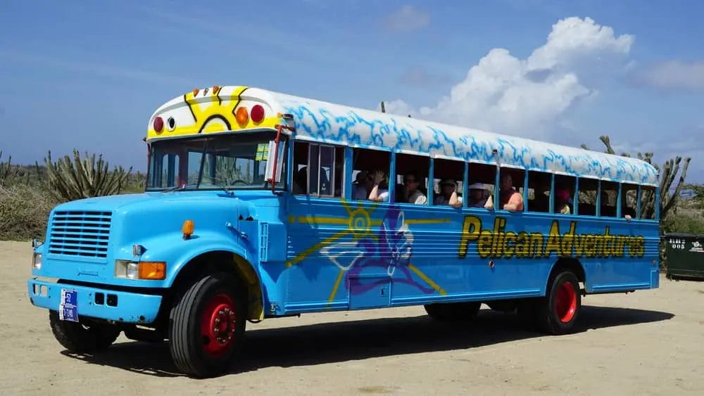 Getting around in Aruba with a colorful bus – Aruba vs Mexico